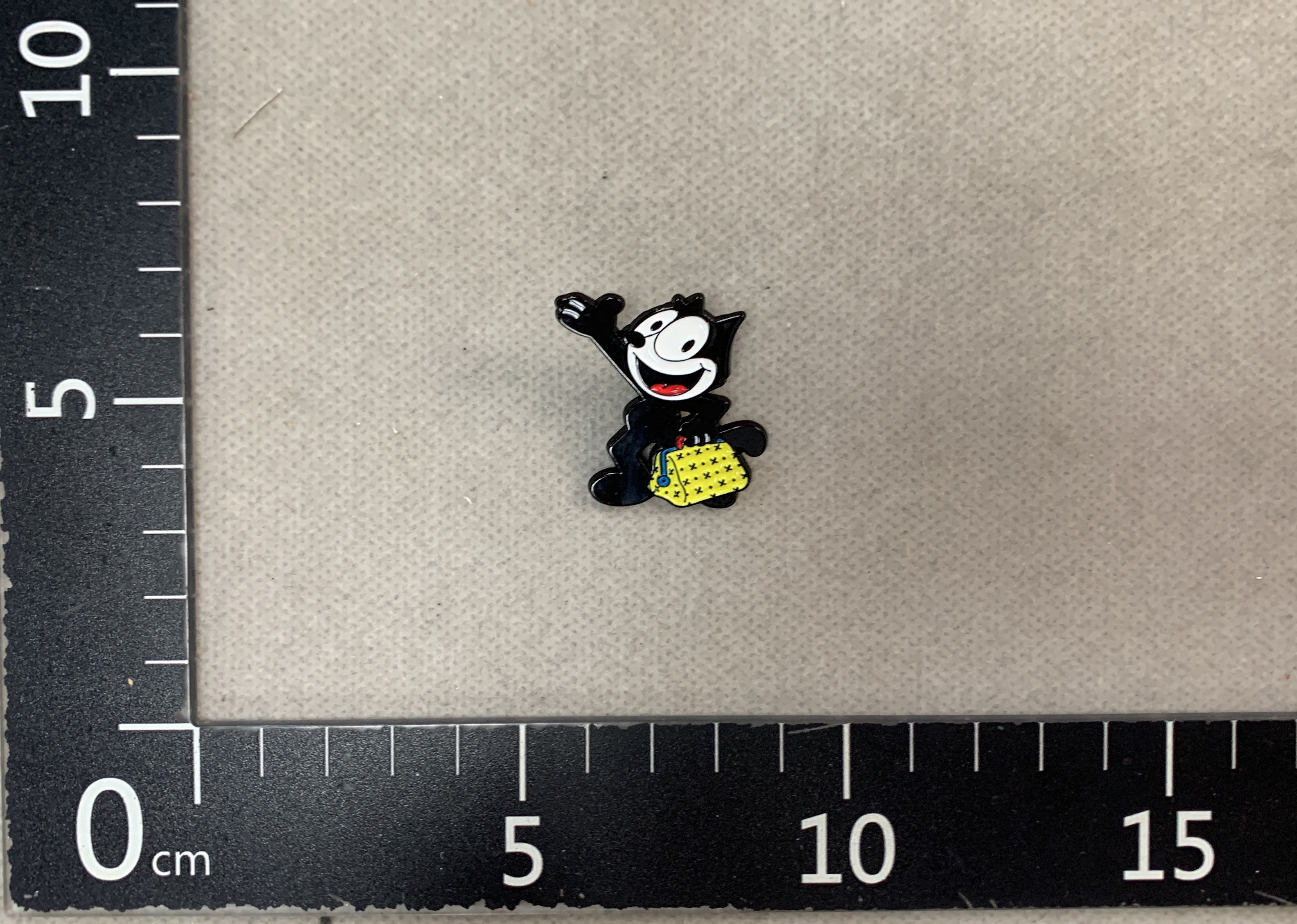 Felix the cat with dagger brooch – cute cartoon metal badge for bags, clothes, and accessories – small gift 3